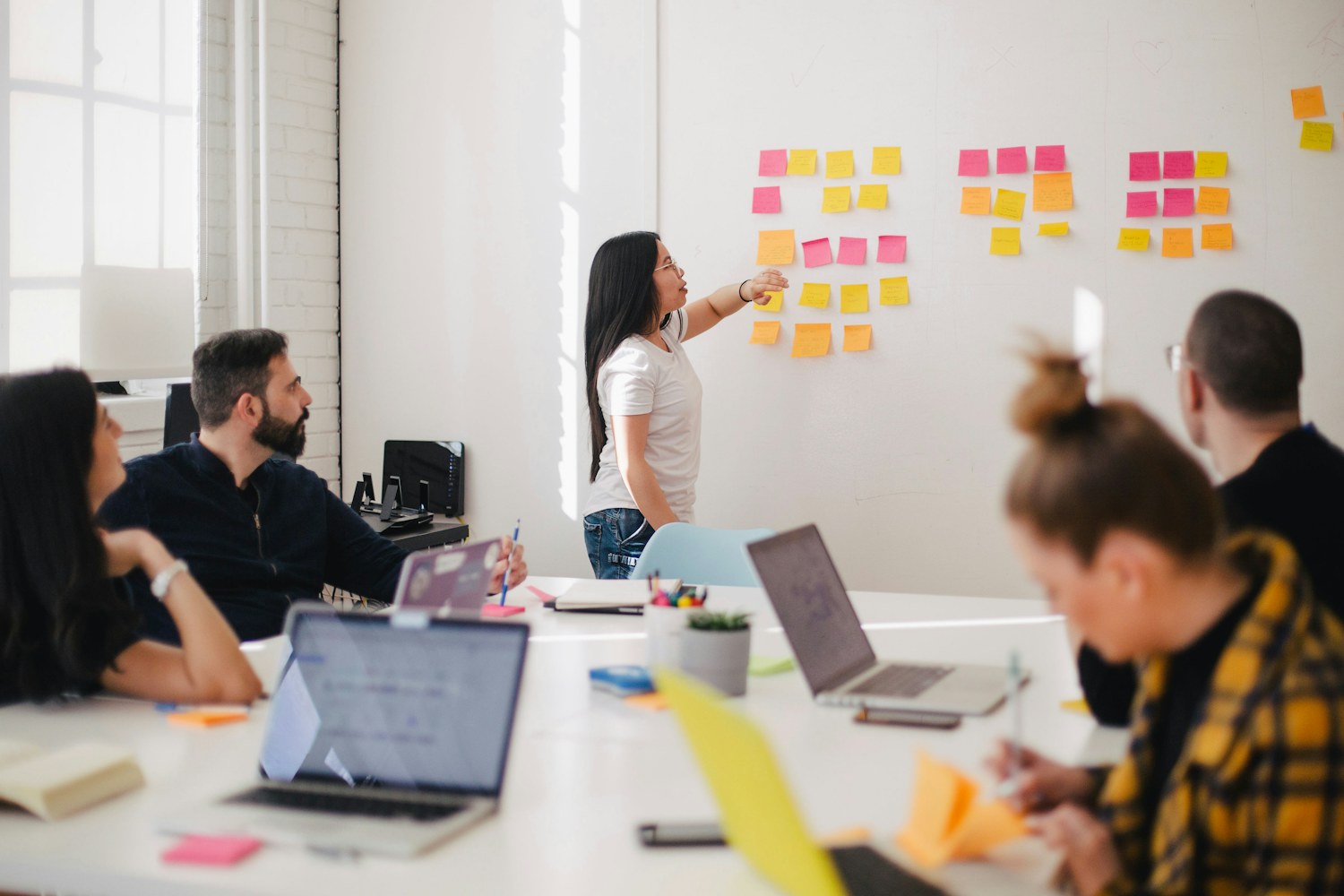 Colleagues planning work together in a shared workspace